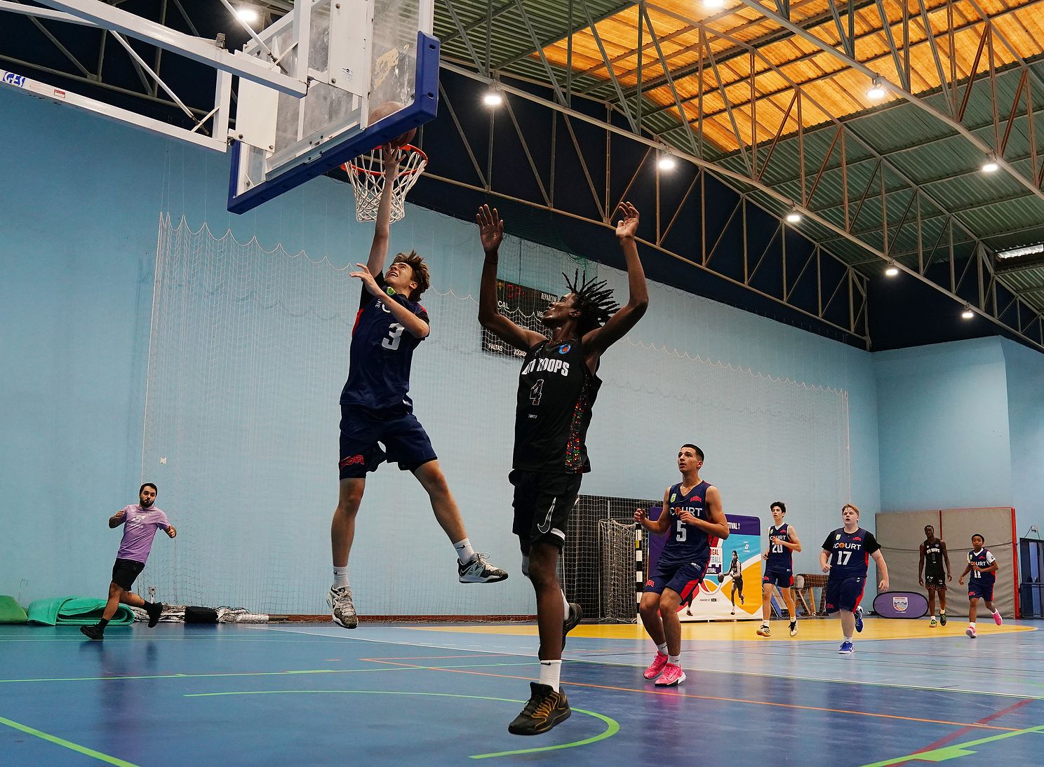 Youth basketball players competing at the Portugal Basketball Festival